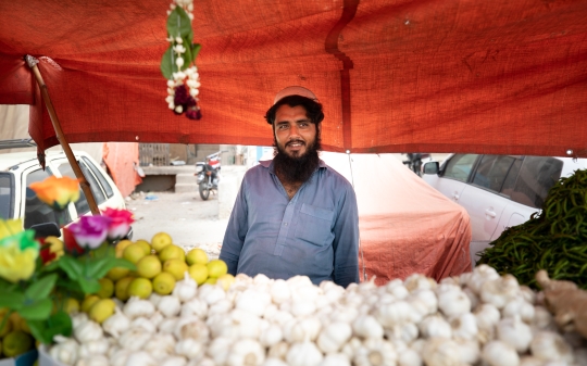 man-with-garlic-in-the-foreground