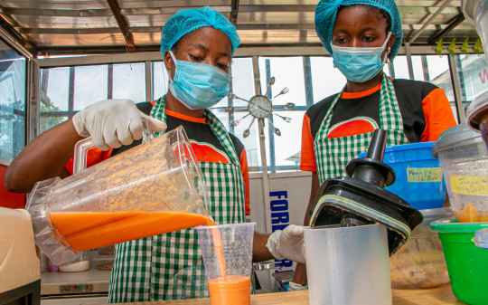 Two women working in kitchen